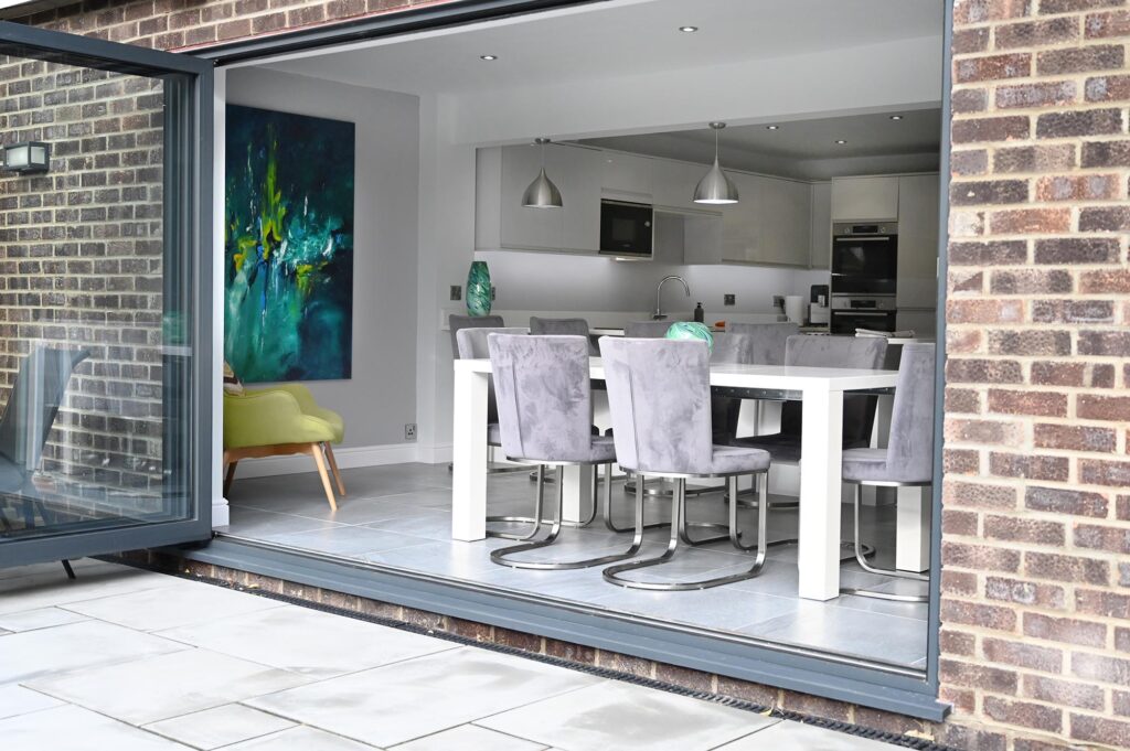 House Extension, Suffolk Bulding company project, modern Kitchen with Bifold doors onto pation 